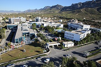 Girne American University logo